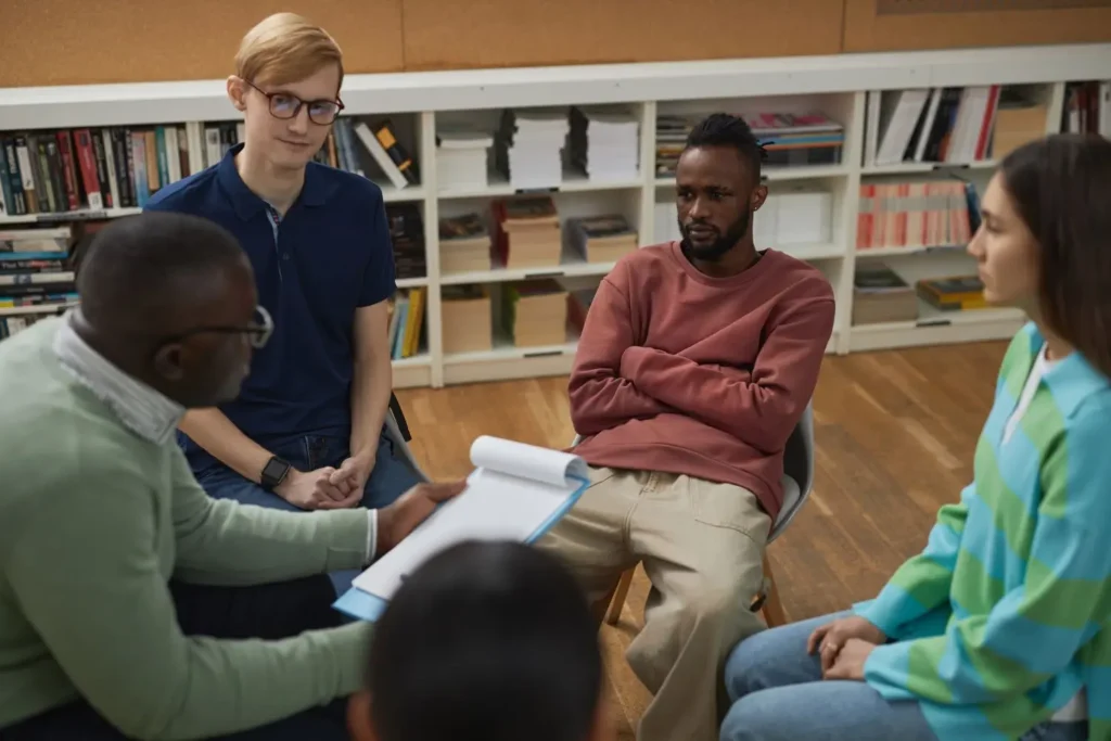 People assembled in a help group, all of whom struggle from fentanyl addiction
