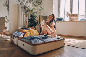 woman packing for out-of-state rehab