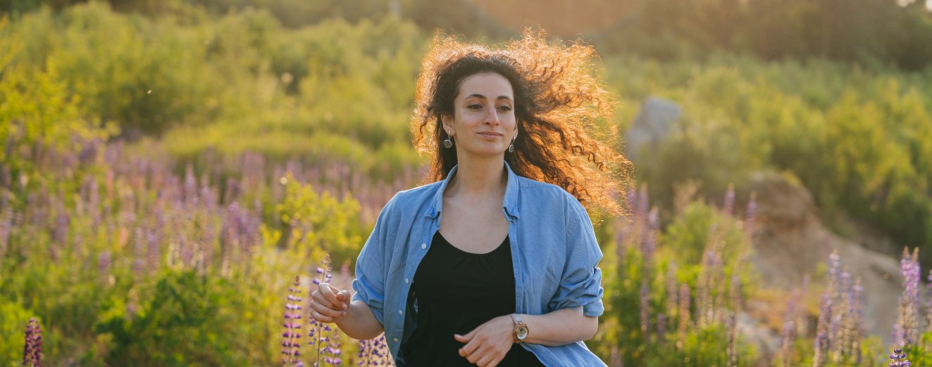 serene woman in a denim shirt standing among purpl 2025 01 08 23 16 45 utc 1 | Detox California