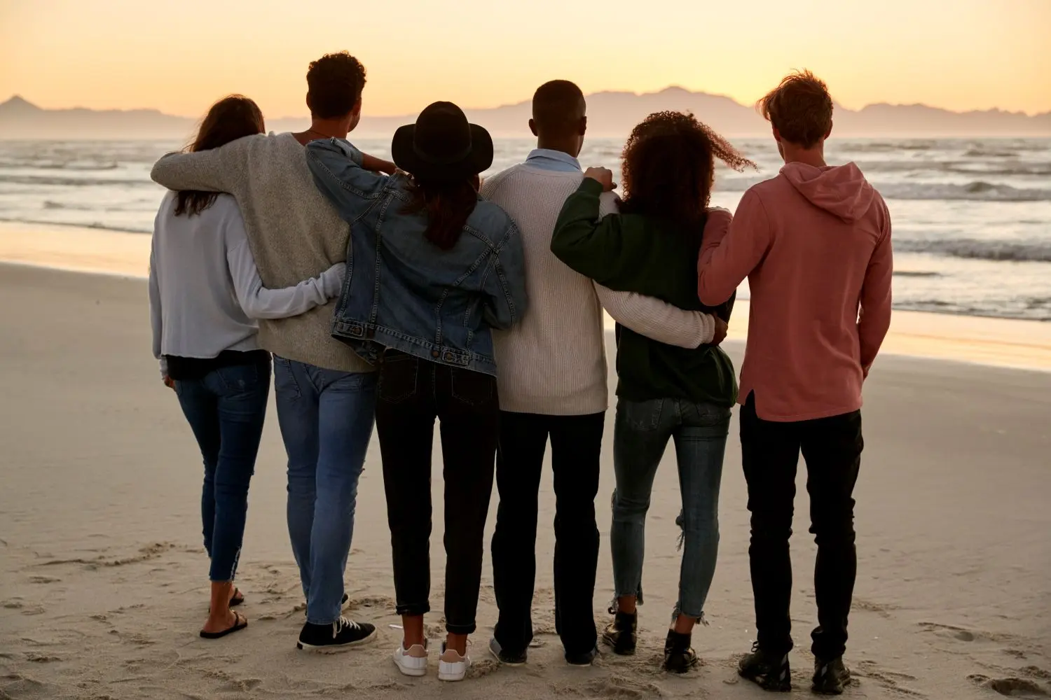 group of friends on winter beach watching sunrise 2026 01 05 06 30 19 utc | Detox California