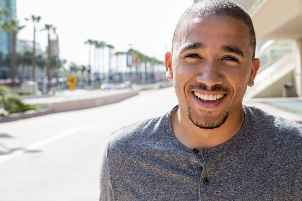 portrait of a smiling young man standing in a stre 2026 01 09 08 40 37 utc Large | Detox California