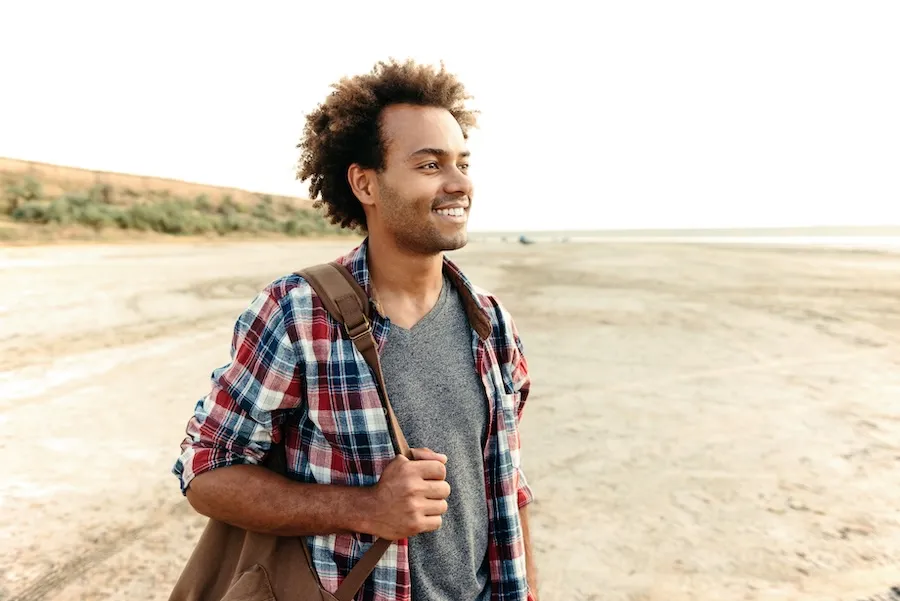 happy curly african young man with backpack on the 2026 01 09 14 43 01 utc | Detox California