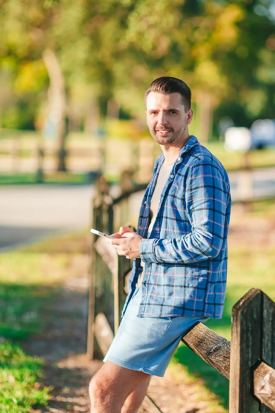 portrait of young man with smart phone in the park 2026 03 18 17 35 44 utc | Detox California